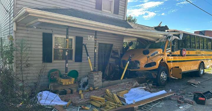 School bus crashes through front of Forward Township home