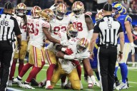 Short-handed 49ers stop Rams on downs in overtime, preserving a 26