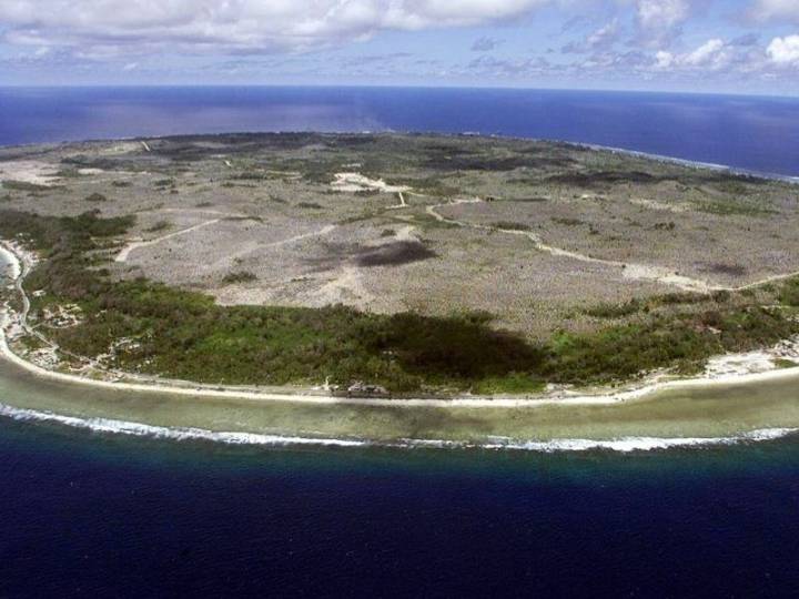 Australia dispatches immigrants to remote Pacific atoll