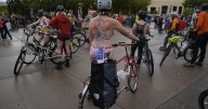 Naked bike riders demonstrate against federal troops in 'quintessentially Portland' protest