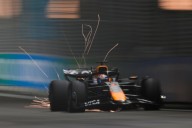 George Russell wins F1’s Singapore GP as McLaren secures constructors’ title
