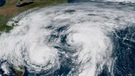 Bermuda lashed by distant hurricane and prepares for the stronger Imelda