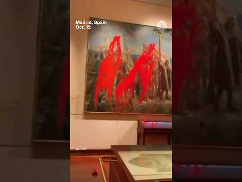 Climate activists vandalize Christopher Columbus painting on Spain's National Day