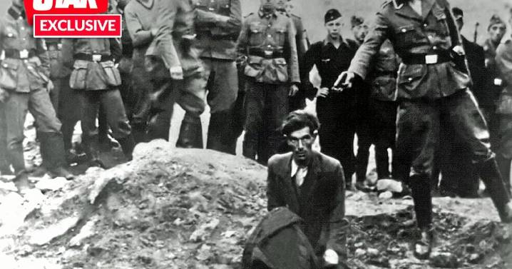 Nazi executioner in one of the Holocaust's most harrowing pictures is finally unmasked