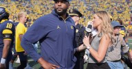 Michigan and coach Moore drop appeal of NCAA penalties from sign