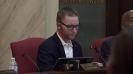 City official returns to work after set on fire