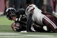 The Latest: Penn State and Texas drop out of the AP Top 25 as Miami reclaims its No. 2 spot