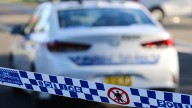 NSW Police charge woman, man for allegedly setting a man on fire in regional NSW