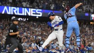 Dodgy throw helps LA advance in MLB playoffs