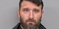 New Albany man accused of climbing ladder to film neighbors in bathroom