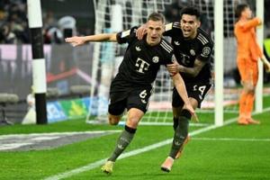 Bayern beat 10-man ‘Gladbach to match European record