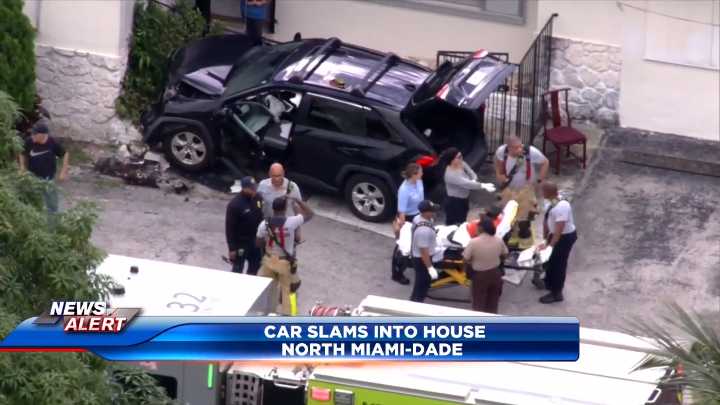 Woman hospitalized after crashing into North Miami