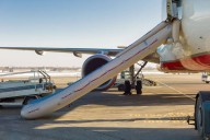 United Passenger Attempted to Open Cabin Door, Deploying Emergency Slides at Houston Airport