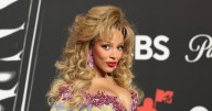 Doja Cat Wore A Plunging Top & 'Showgirl' Orange Tights In NYC