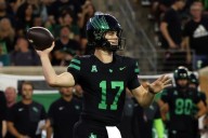 No. 24 South Florida scores 4 TDs in a 4 1/2-minute span and hands North Texas its 1st loss