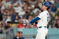 Ohtani hits 2 homers for Dodgers in playoff opener against Reds