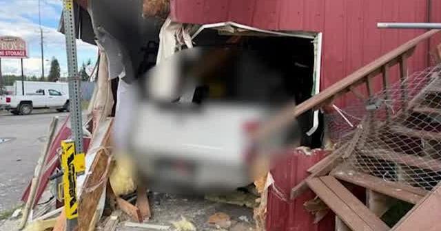Truck crashes into building in Sagle, 2 people rescued by firefighters