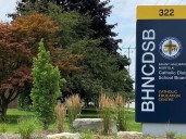 Catholic trustee under fire for not repaying expenses for trip resigns