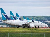 Dozens of WestJet pilots to lose jobs under new age cap policy; union files grievance