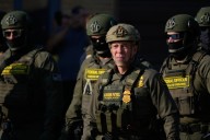 Noem visits Chicago area ICE facility as agents arrest 13, raid city neighborhoods