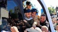 Freed Palestinian prisoners greeted by cheering crowd
