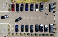 Parents of two college students killed in a Tesla allege design flaw trapped them in the burning car