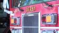 Grass fire destroys outbuilding in Derby