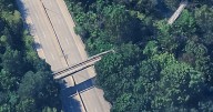 St. Louis water division truck damaged Forest Park pedestrian bridge
