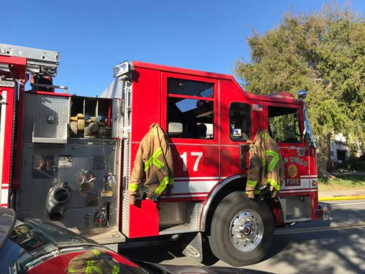 Crews put out garage fire, but blaze sends one person to hospital
