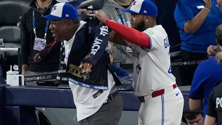 Joe Carter wears Blue Jays' home run jacket after throwing first pitch at World Series Game 2