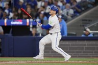 Toronto's Daulton Varsho tries to hit grounders to the pitcher. The Dodgers wish he would