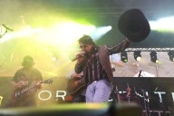 Country singer slips and falls off stage, doesn’t stop singing: ‘What a legend’