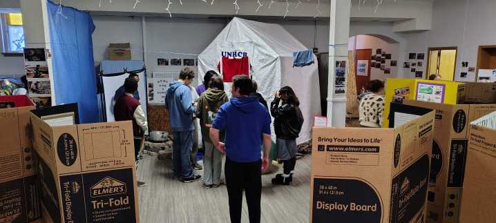 Students walk through the struggles of refugees at YWCA’s Camp Hope exhibit