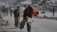 Palestinians return to ruins in Gaza as ceasefire holds