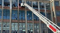 Sanford firefighters knock down fourth-floor fire at vacant mill building