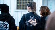 Community gathers for vigil to honor the life of Timothy Hutchinson