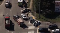 Bank robbery suspect in hospital for self-inflicted injuries after car chase, foot pursuit
