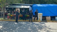 Detienen a policía municipal y a taxista por presunta extorsión a comerciante en Playa del Carmen