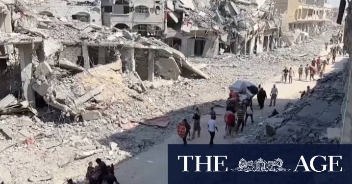 Thousands of Palestinians return to what remains of their homes as Gaza ceasefire begins