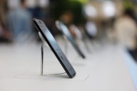 Apple becomes third Big Tech company to top $4 trillion in market value after luring customers back with latest iPhones