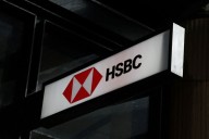 HSBC third-quarter profit slides 14% on legal charges but lifts income outlook