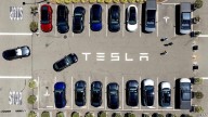 Parents of two college students killed in a Tesla allege design flaw trapped them in the burning car