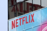 Exclusive-Netflix taps bank to explore bid for Warner Bros Discovery