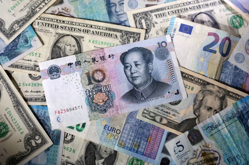 Dollar hits two-week high against yen as trade talks, Fed meeting loom