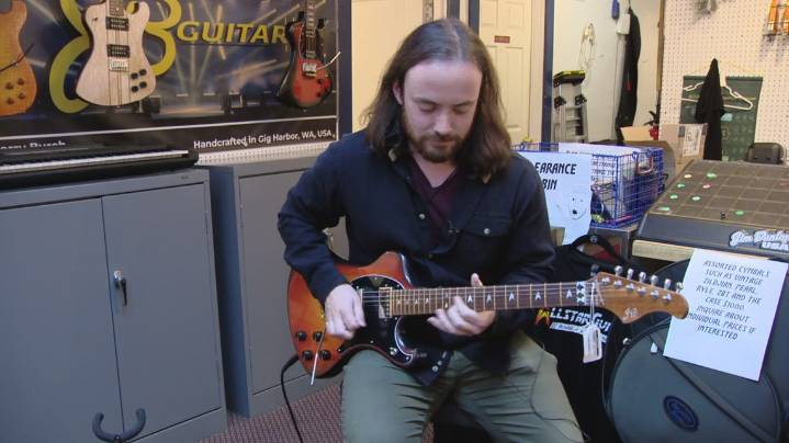 Gig Harbor guitar shop owner battles credit card scam