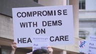 Government workers rally with lawmakers challenging federal firings during shutdown