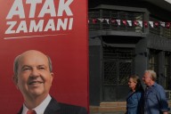 Turkish Cypriots vote in an election seen as a choice on deeper Turkey ties or closer EU relations