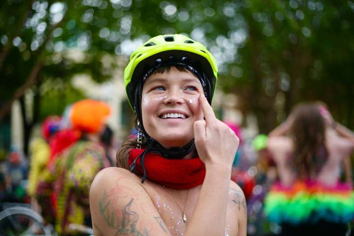 Portland cyclists strip down in pouring rain to protest ICE facility and Trump troop deployment