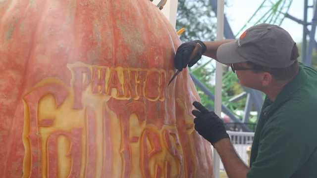 Iowa's largest pumpkin: Artist carving massive pumpkin at Adventureland's Phantom Fall Fest