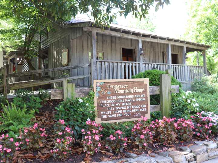 Take a look inside Dolly Parton's childhood home, a 2-room log cabin where she lived with her 11 siblings
